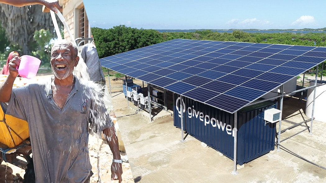 A man covers himself in water generated by a solar water farm